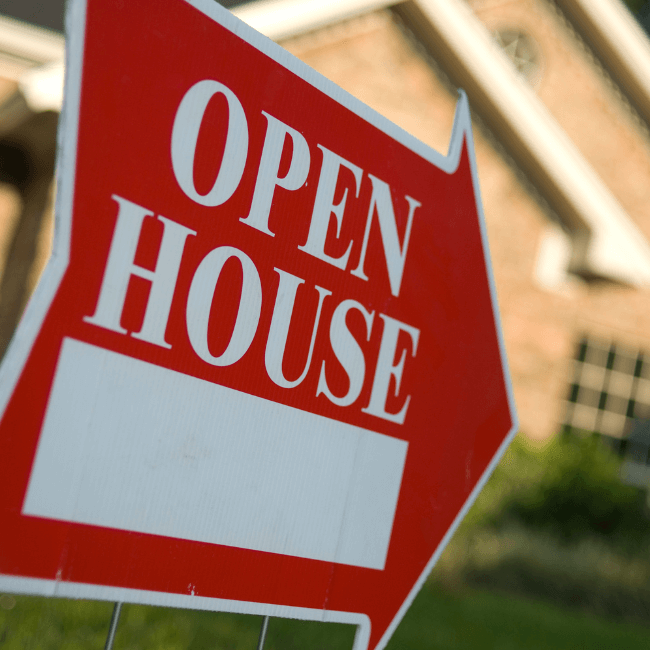 An Open House Sign In Front Of A House — Howells & Co Legal & Conveyancing In Cessnock, NSW