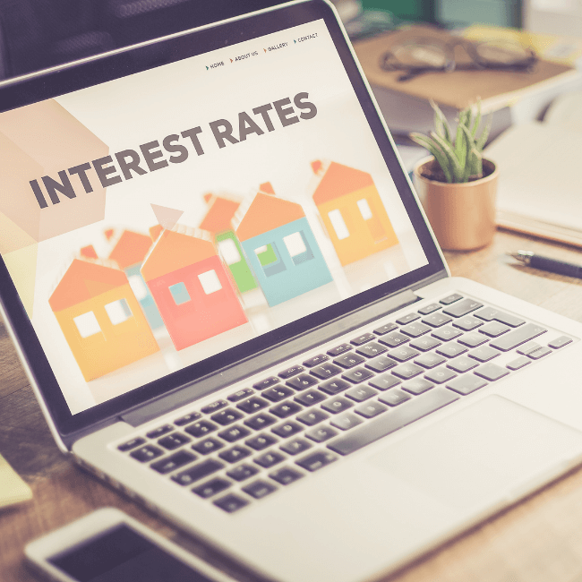 A Laptop Is Open To A Page That Says Interest Rates — Howells & Co Legal & Conveyancing In Cessnock, NSW