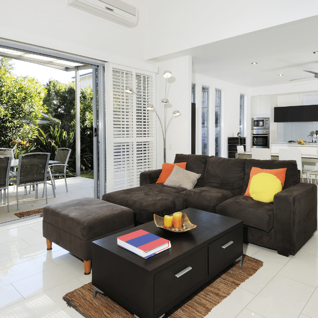 A Living Room With A Couch And A Coffee Table — Howells & Co Legal & Conveyancing In Cessnock, NSW