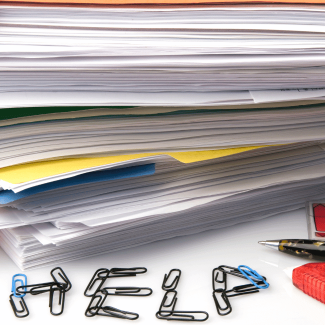 A Stack Of Paper With The Word Help Written On It — Howells & Co Legal & Conveyancing In Cessnock, NSW