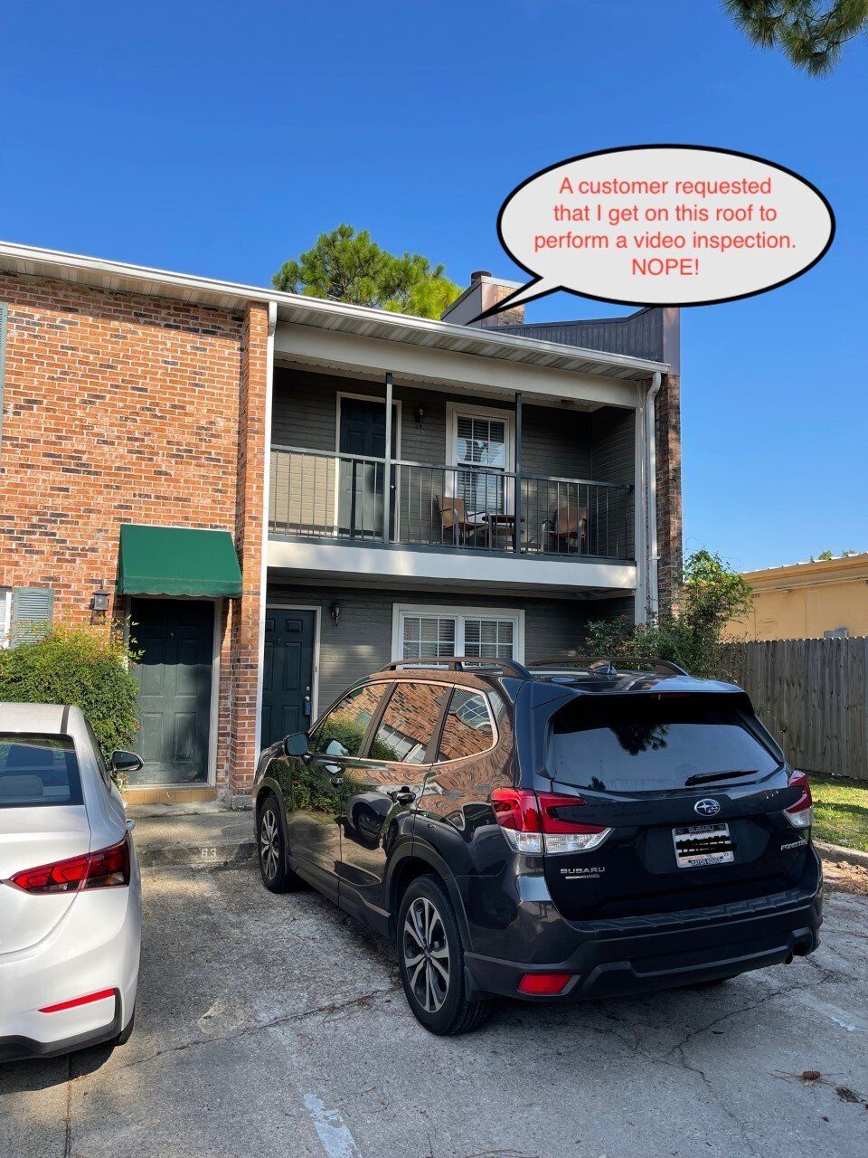 Apartment building with a black SUV in front. Text bubble: