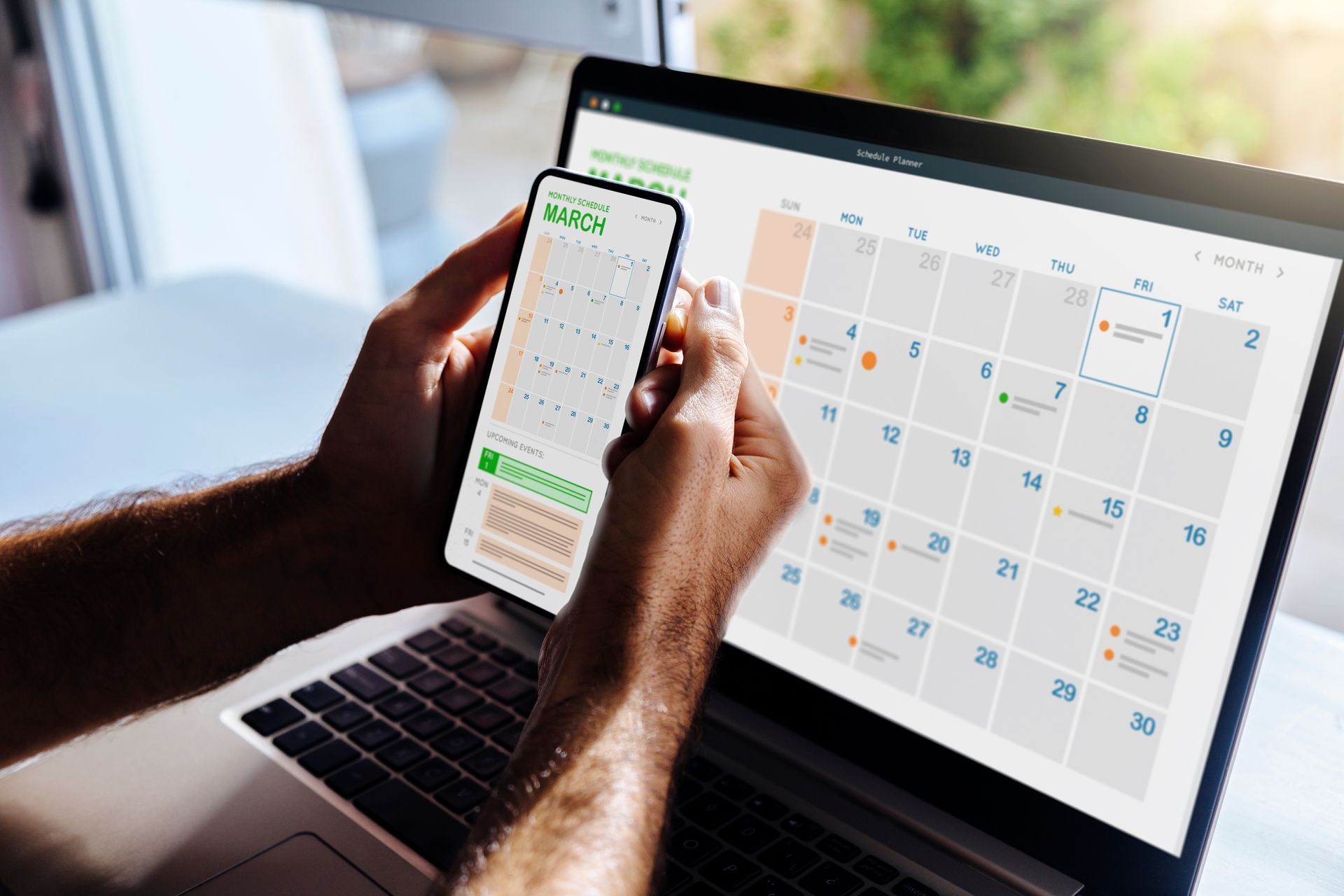 Man looking at calendar on phone and laptop, early in the morning for planning the day. Digital schedule concept. Man looking at calendar on phone and laptop, early in the morning for planning the day. Digital schedule concept.
