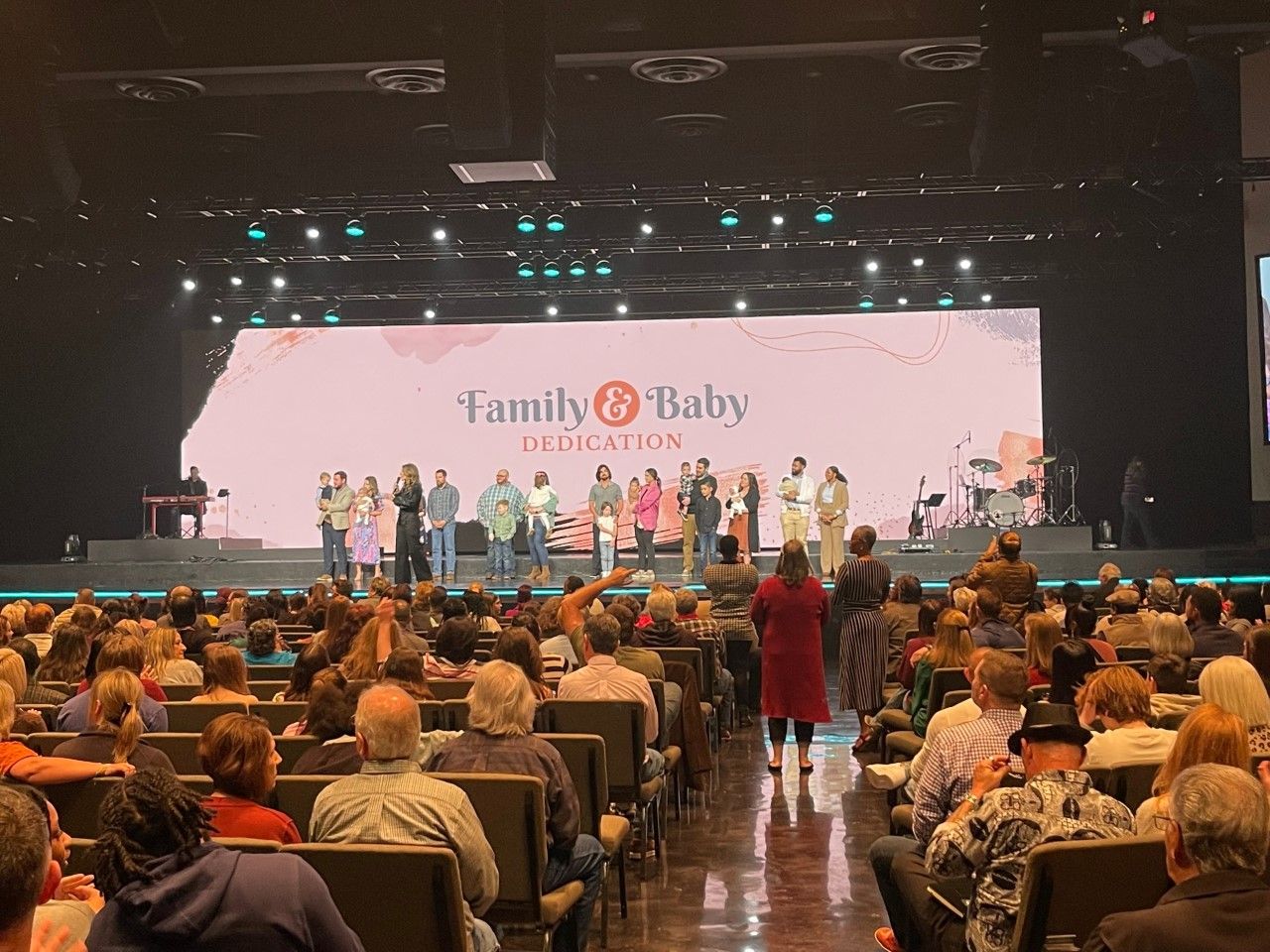 Audience watches a stage with