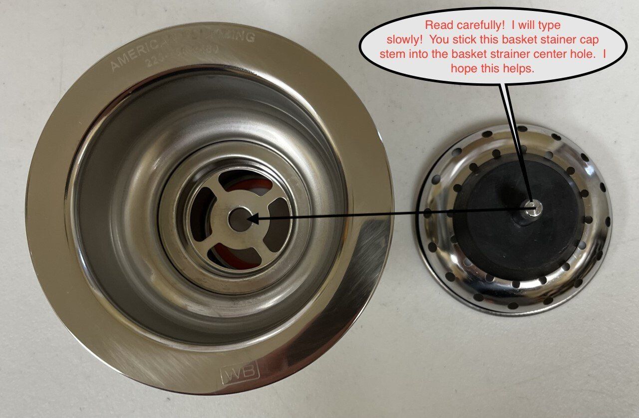 Stainless steel sink drain with a stopper; instructions note to fit stopper in drain.