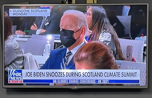 Joe Biden wearing a mask appears to be sleeping at the Glasgow climate summit. Fox News graphic is on-screen.