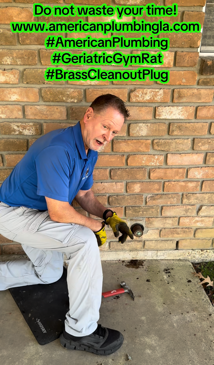 Plumber kneeling by a brick wall, using a drill near a floor drain, with green promotional text above.