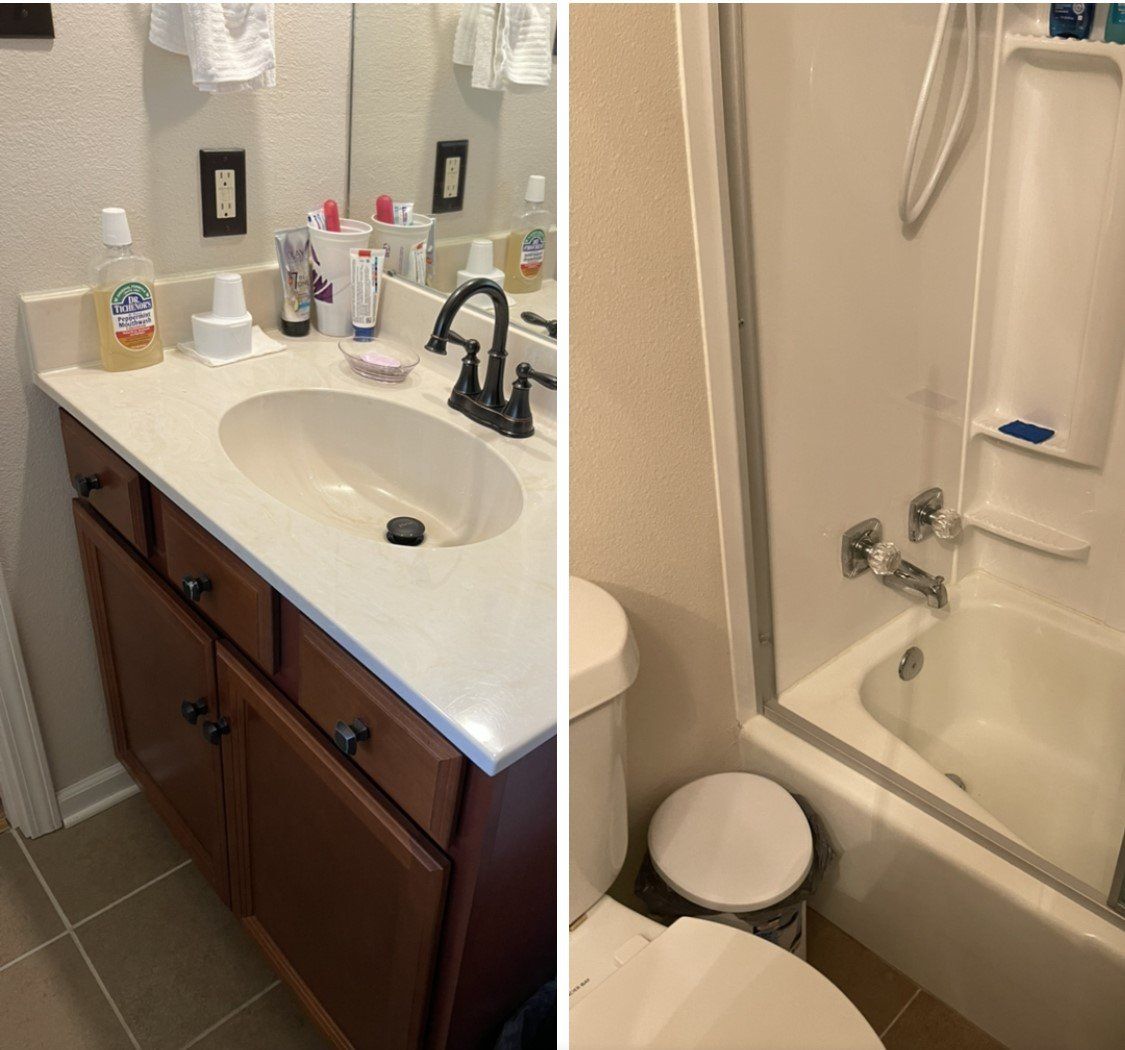 Bathroom vanity and bathtub combo with beige walls, brown cabinets, white sink, and toiletries on the counter.