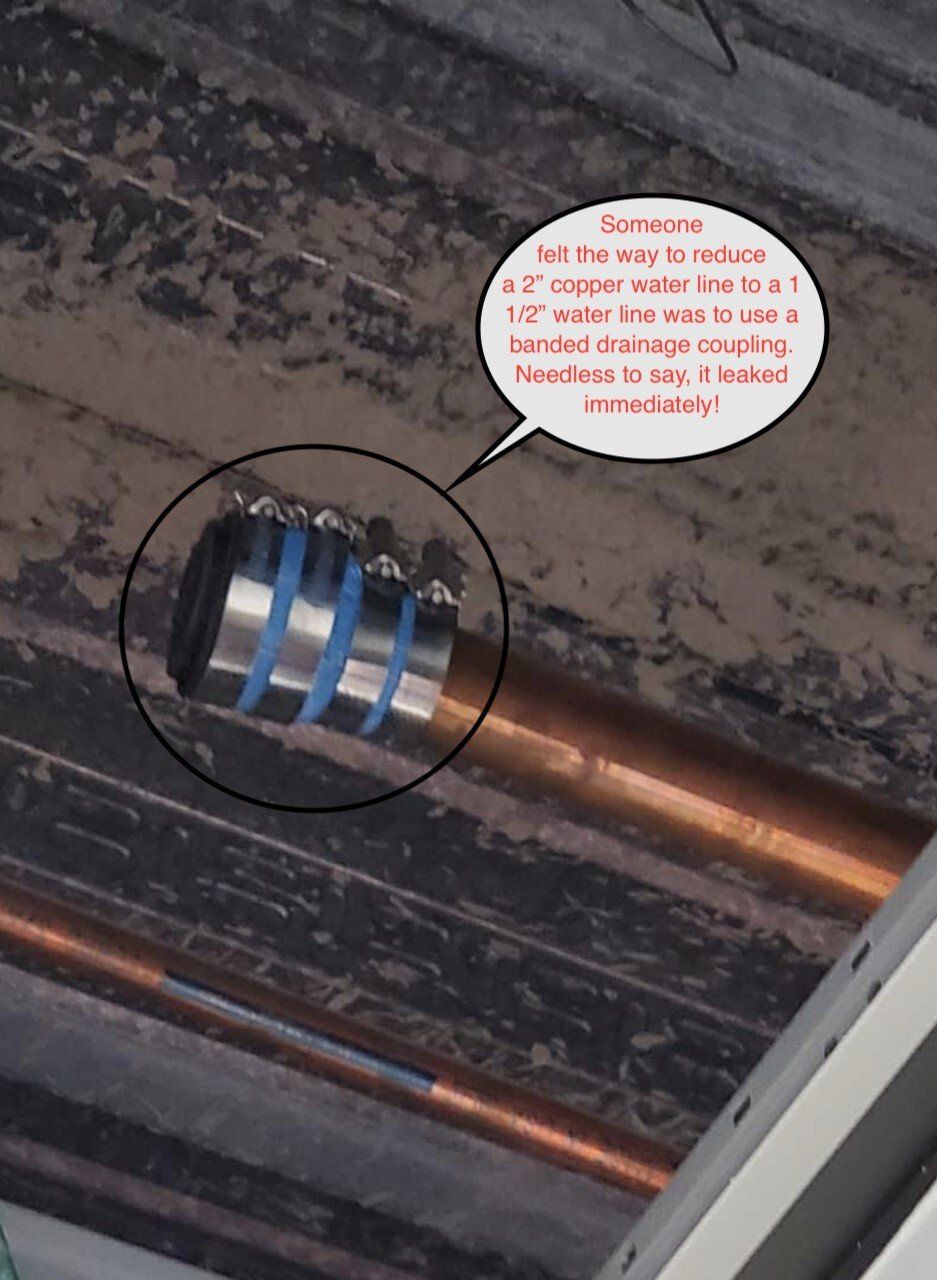 Close-up of a copper pipe with a circled metal fitting and a small speech-bubble note above it.