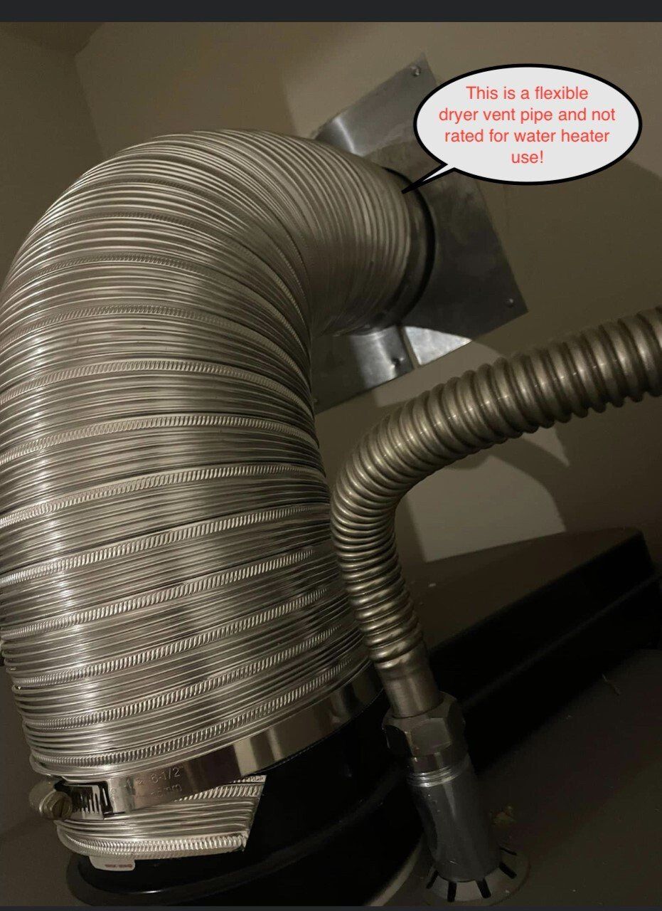 Flexible corrugated pipe, likely for water heater exhaust, connected to the unit and vent.