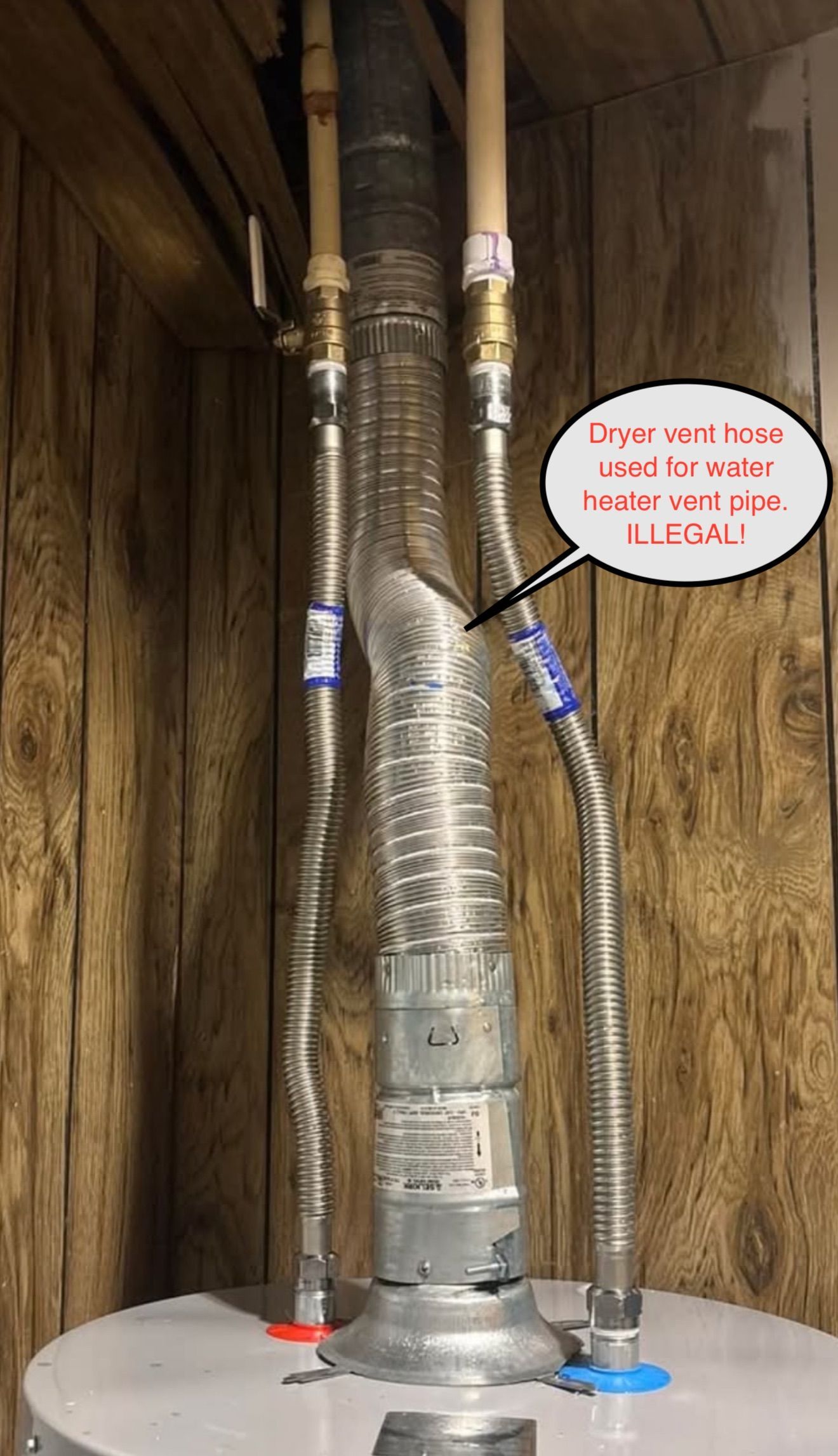 Metal vent pipe insulated with foil tape rising through a wooden attic space, labeled by a callout bubble.