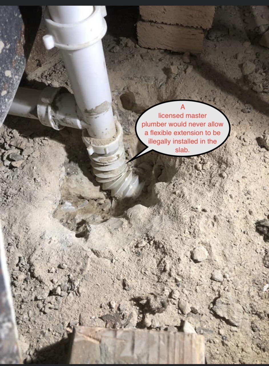 White PVC plumbing pipe in dirt, text states: