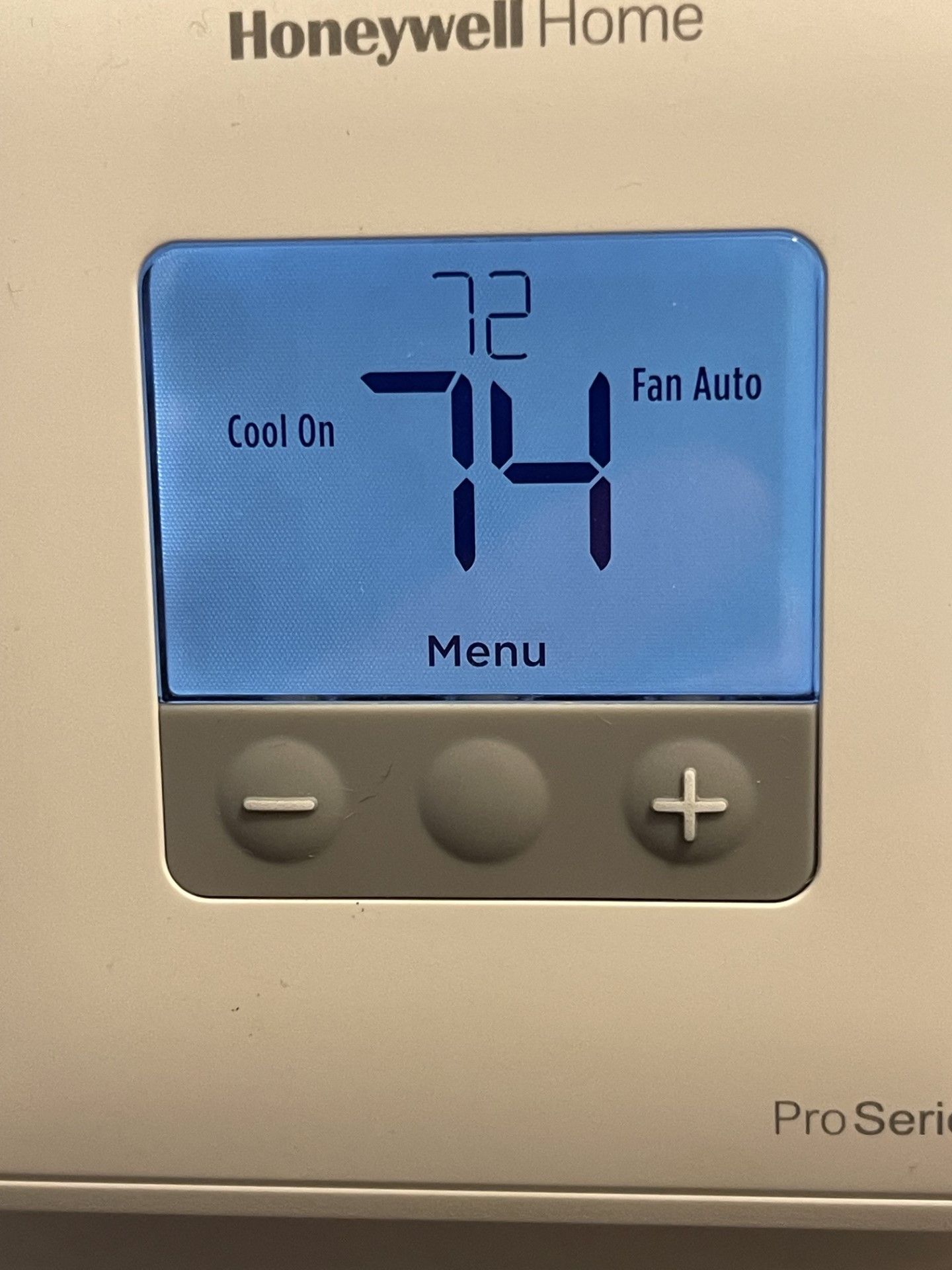 Honeywell Home thermostat showing 74°F, Cool On, Fan Auto