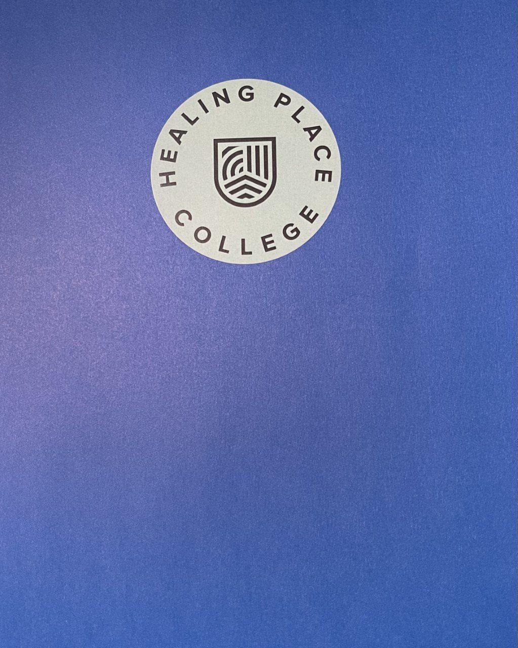 Blue cover with a white circle logo: