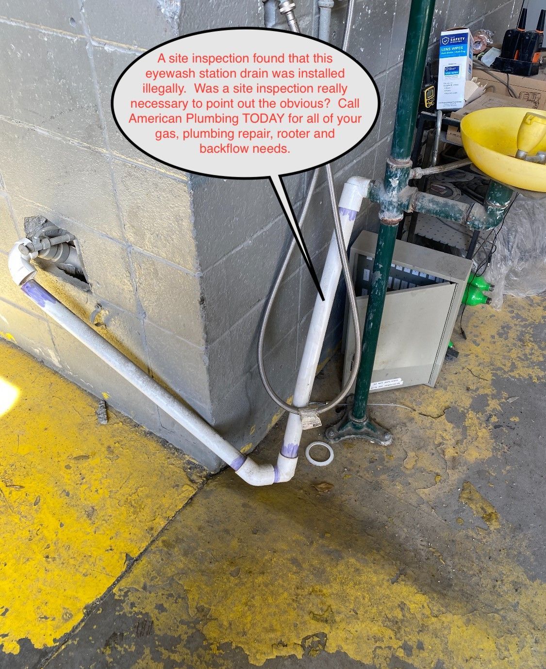 Plumbing with a noted code violation: white PVC pipes, a metal tube, gray cement, yellow floor. Text says