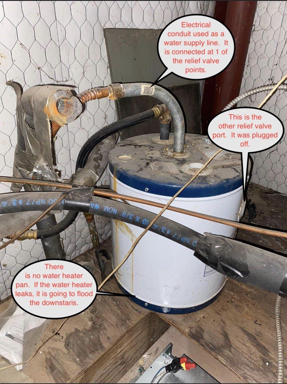 White and blue bucket with hoses and wires in a cluttered utility area; red callout labels point to parts.