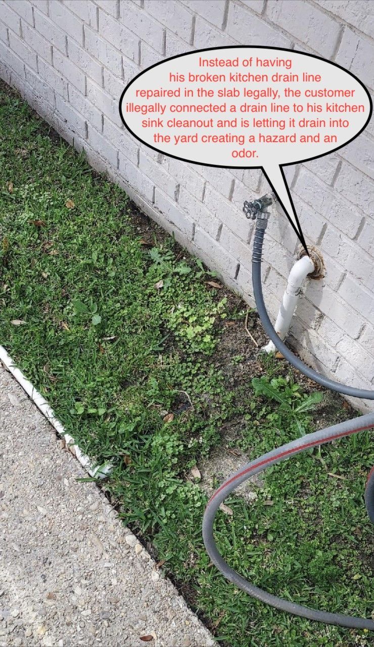 Close-up of a wall pipe and hose beside grass and concrete, with a red text bubble overlay.