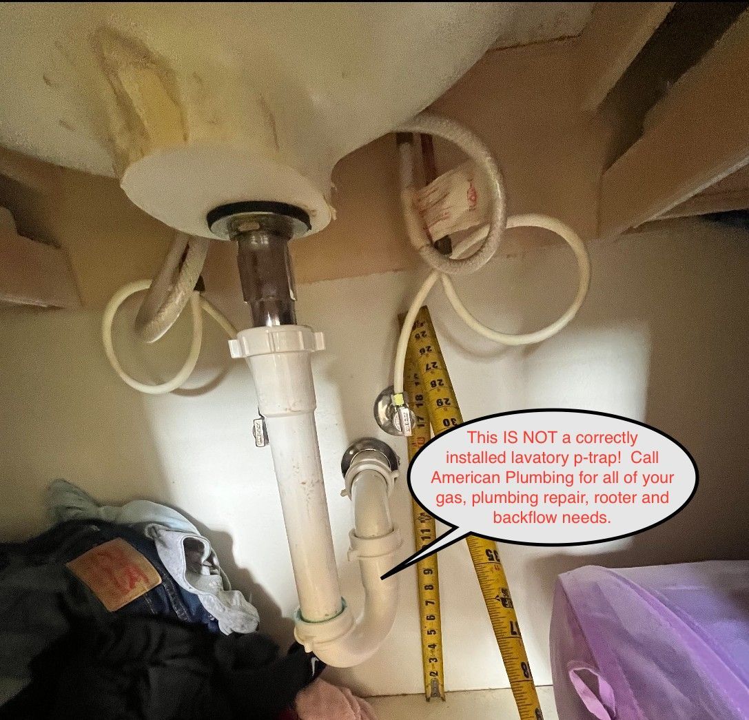 Under-sink plumbing: white pipes and drain. A note urges contacting a plumber for repairs.