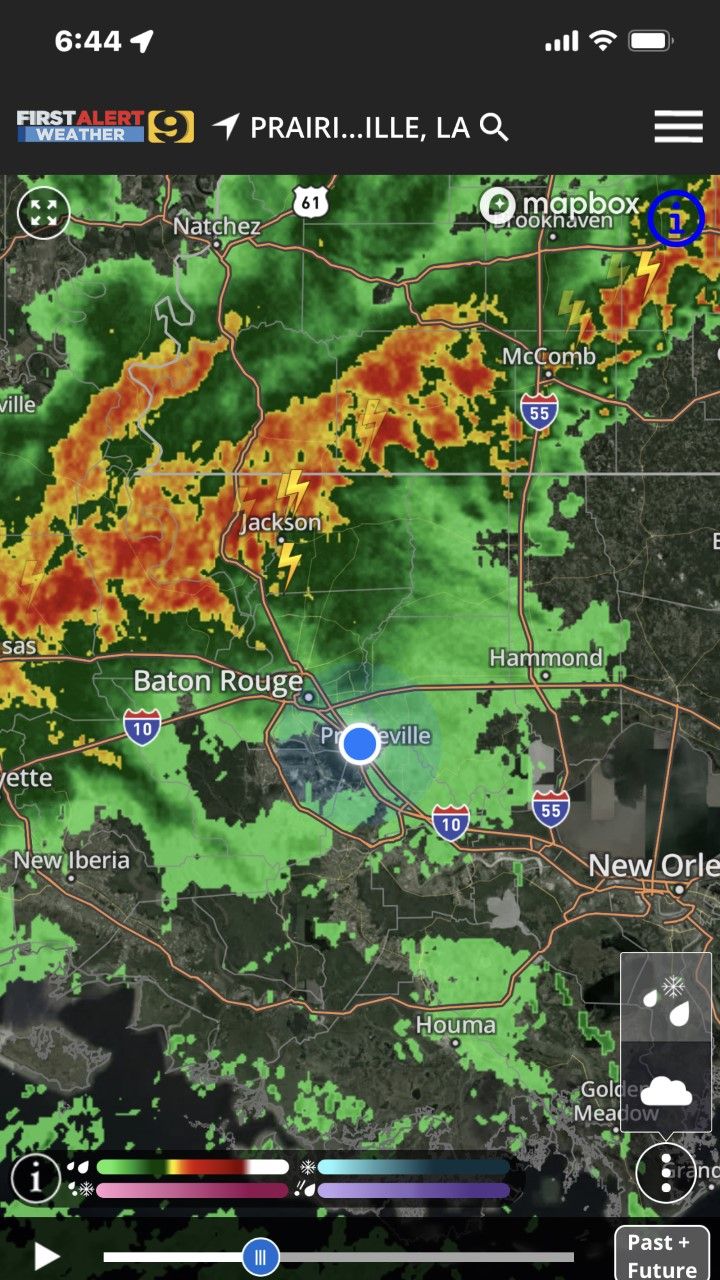 Radar map with heavy rain and storms near New Orleans and Prairieville, LA, marked by a blue location dot.