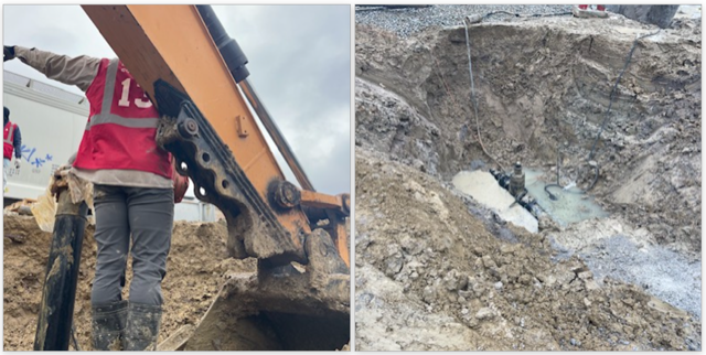 Worker beside excavator in a muddy trench, examining a buried white object in the dirt.