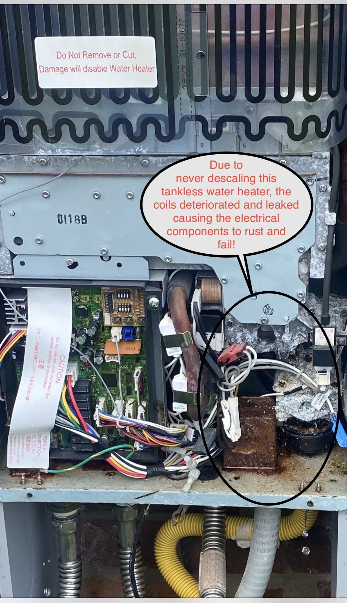 Open electrical panel with exposed wiring and ducting, two labels pointing to repair or inspection areas.