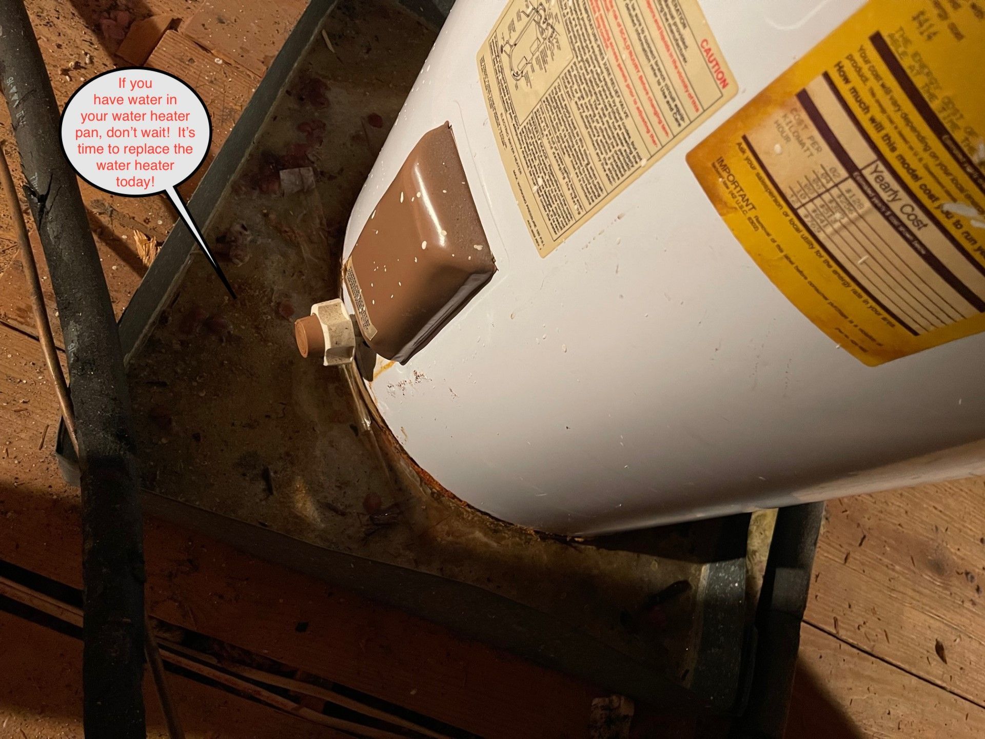 Water heater on a platform with corrosion and a text overlay.