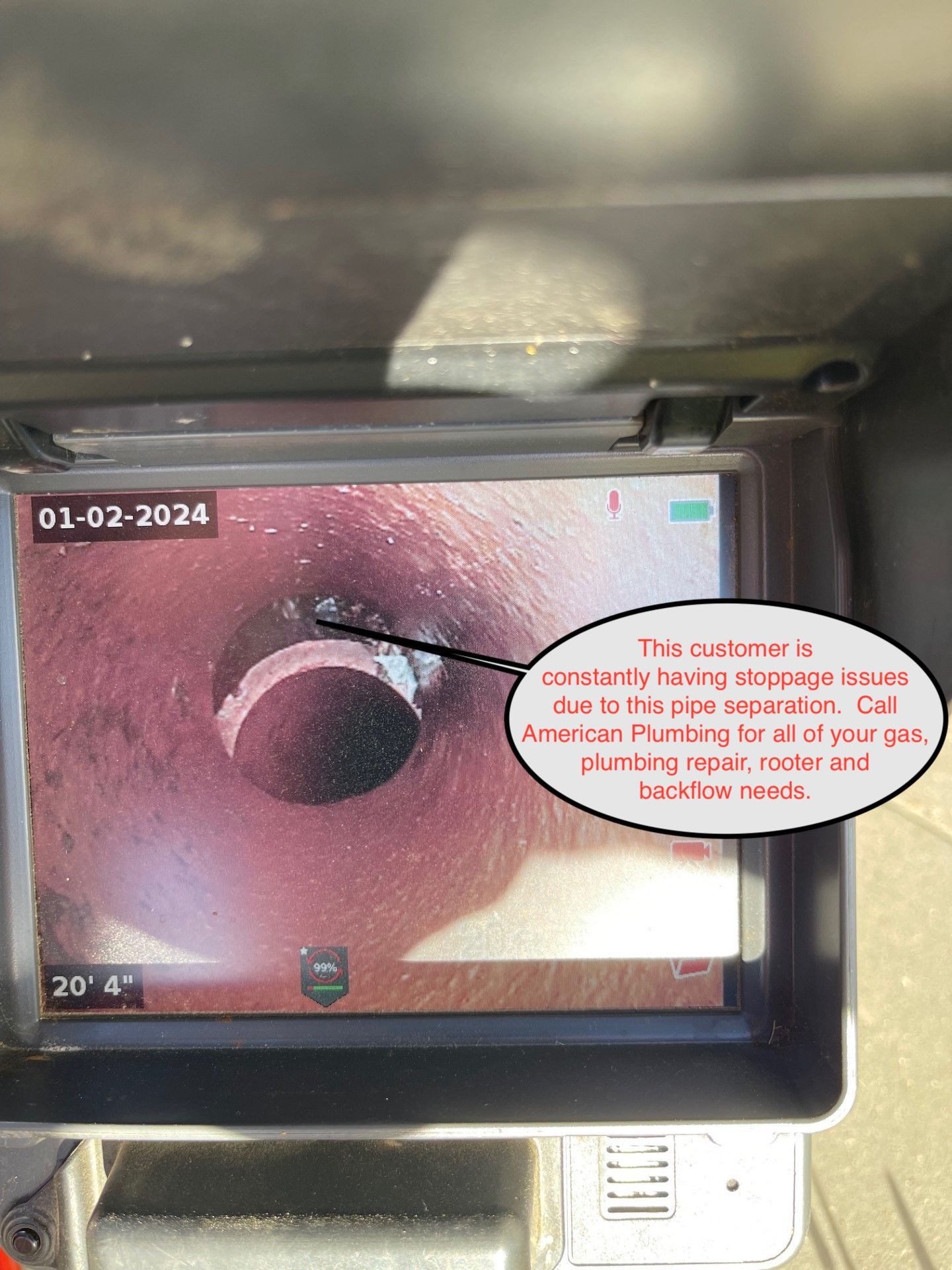 Endoscopy monitor showing a pink intestinal view with on-screen date and annotations
