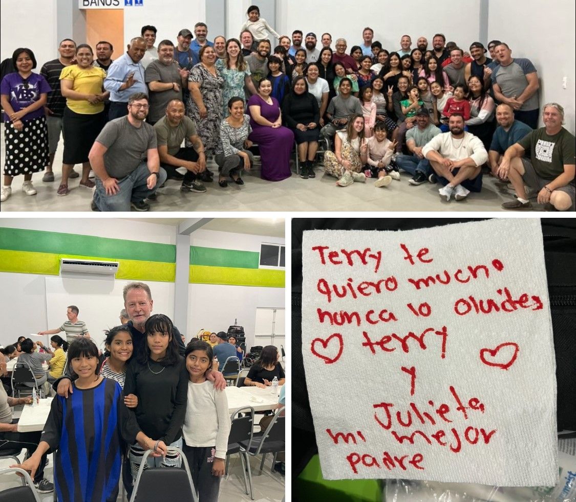 Group photo at a community event, with a handmade sign saying “Terry te quiero mucho” and heart drawings