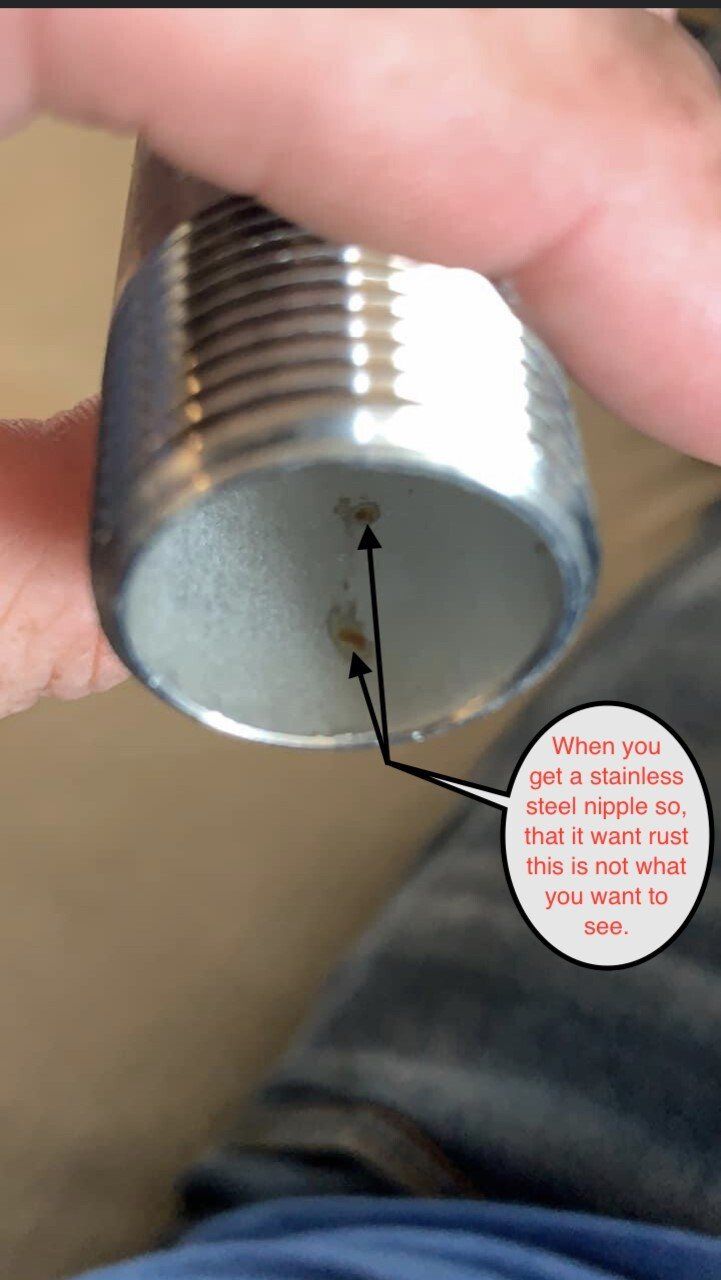 Close-up of the inside of a metal can with two small dots, with text bubble about removing one.
