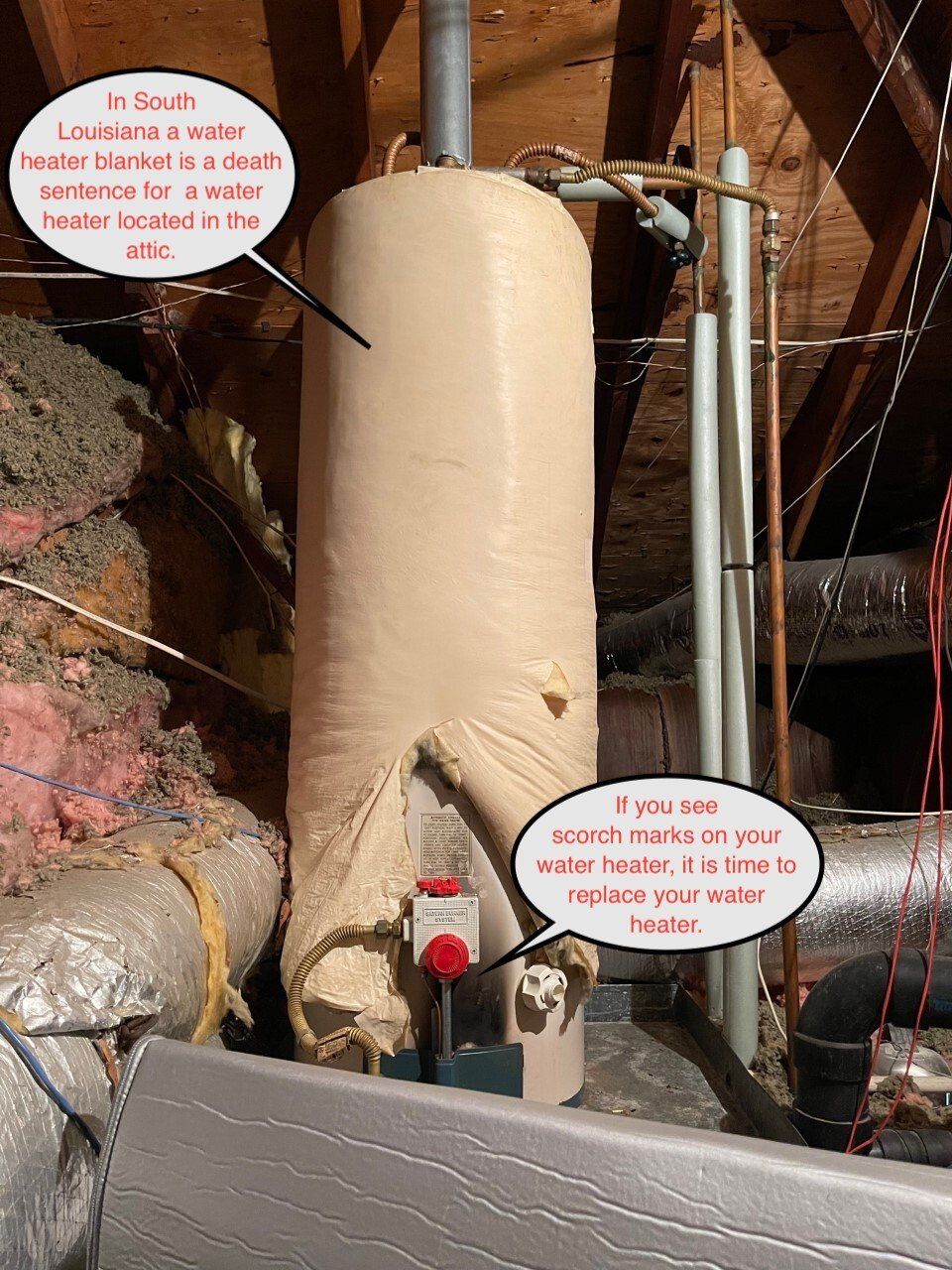 Water heater in an attic. Insulation is damaged. Red button is visible. Text on the photo warns of leaks.