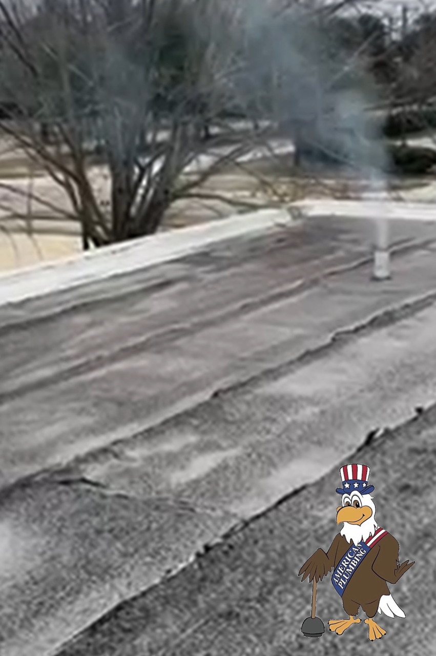 Snow-covered rooftop with a small smoking vent and a cartoon Uncle Sam figure in the corner
