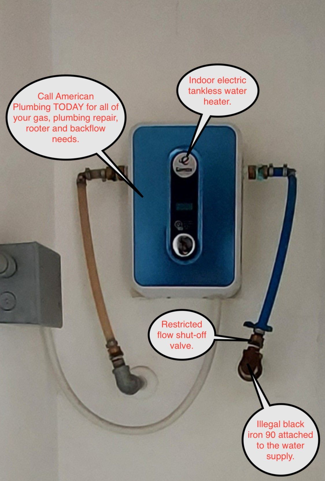 Blue water filter unit with labeled inlet and outlet hoses on a wall-mounted sink setup