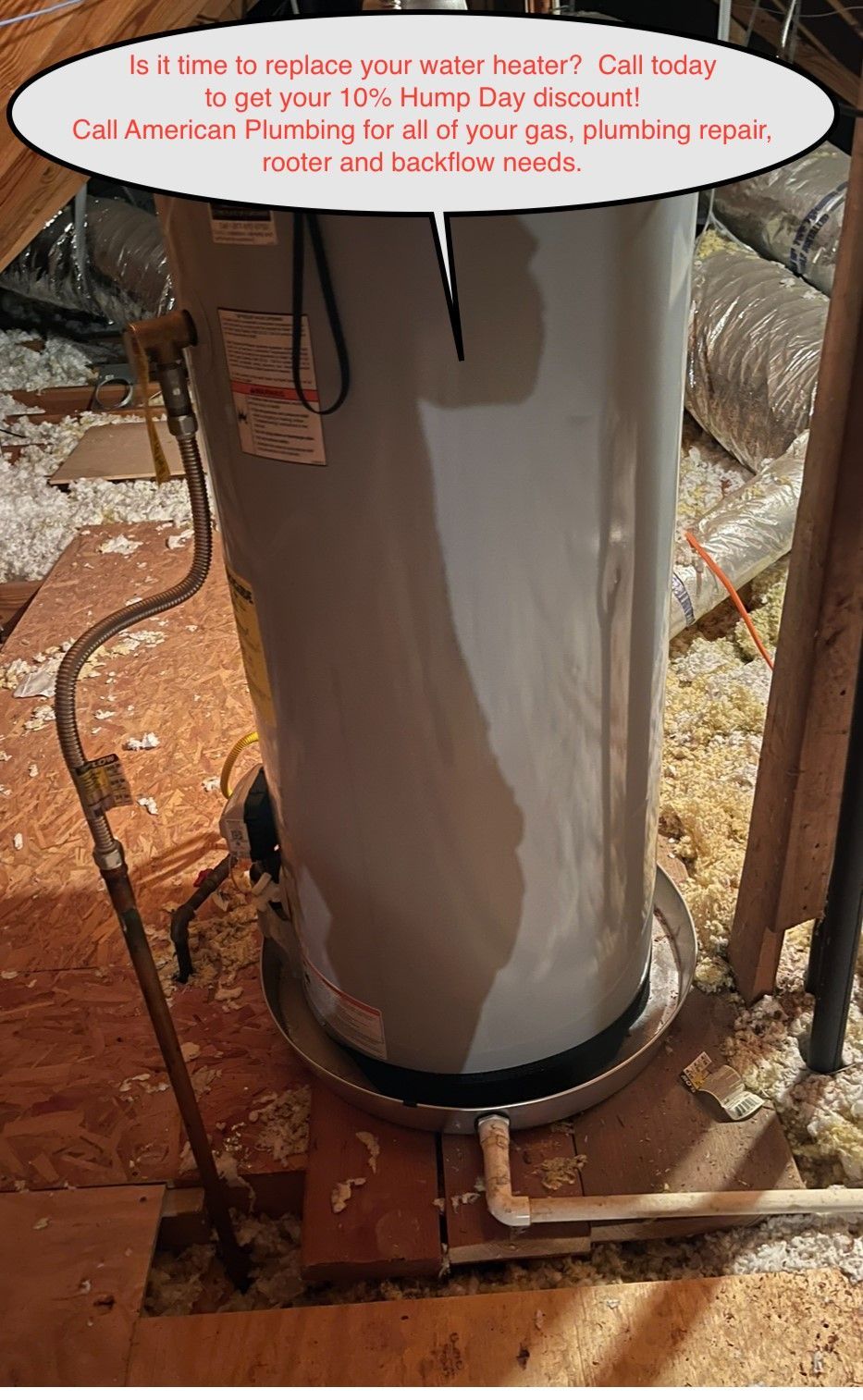 A leaking water heater in an attic with ad for plumbing services: 