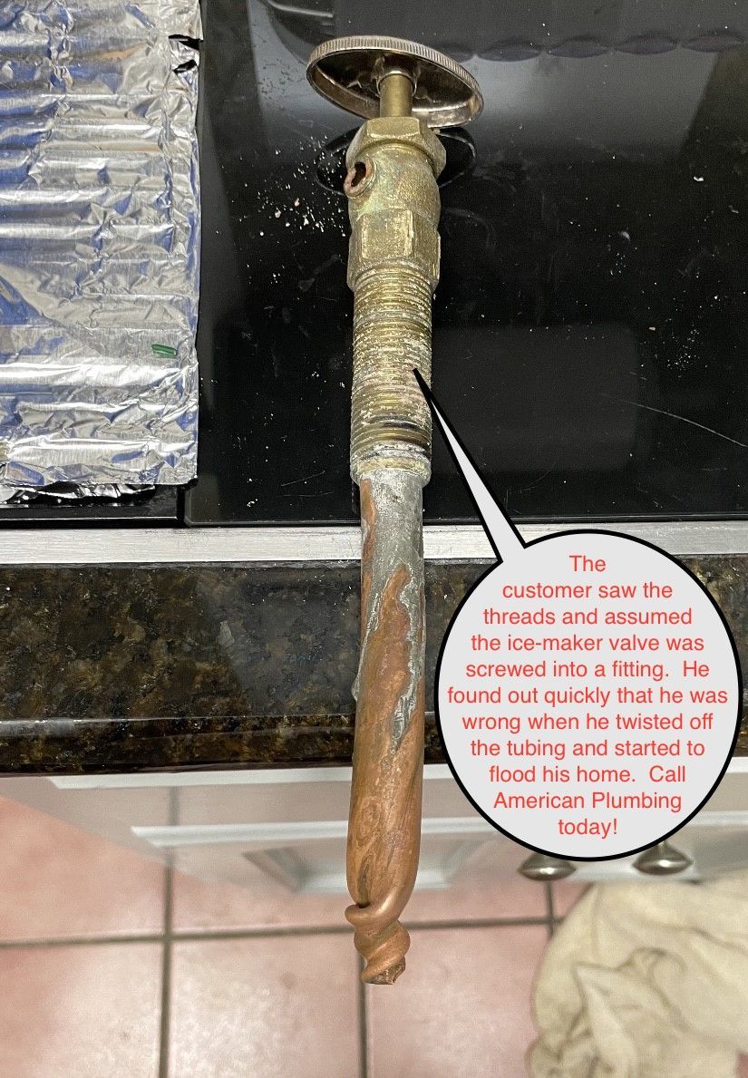 Severely corroded plumbing fixture with a corrosion bubble, next to a black countertop.