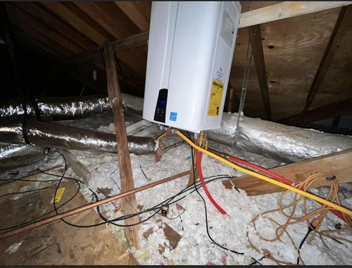 Attic HVAC unit with exposed insulated ductwork and loose wires over ceiling joists