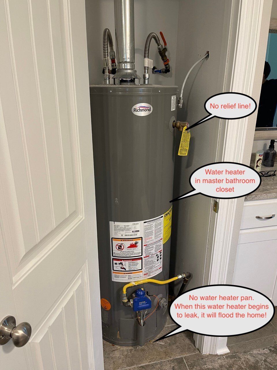 Water heater in closet with warning callouts about no vent and no metal vent.