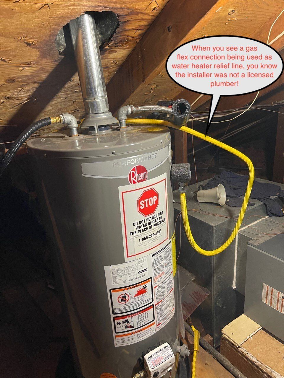 Water heater with vent pipe and yellow gas line in a basement utility area