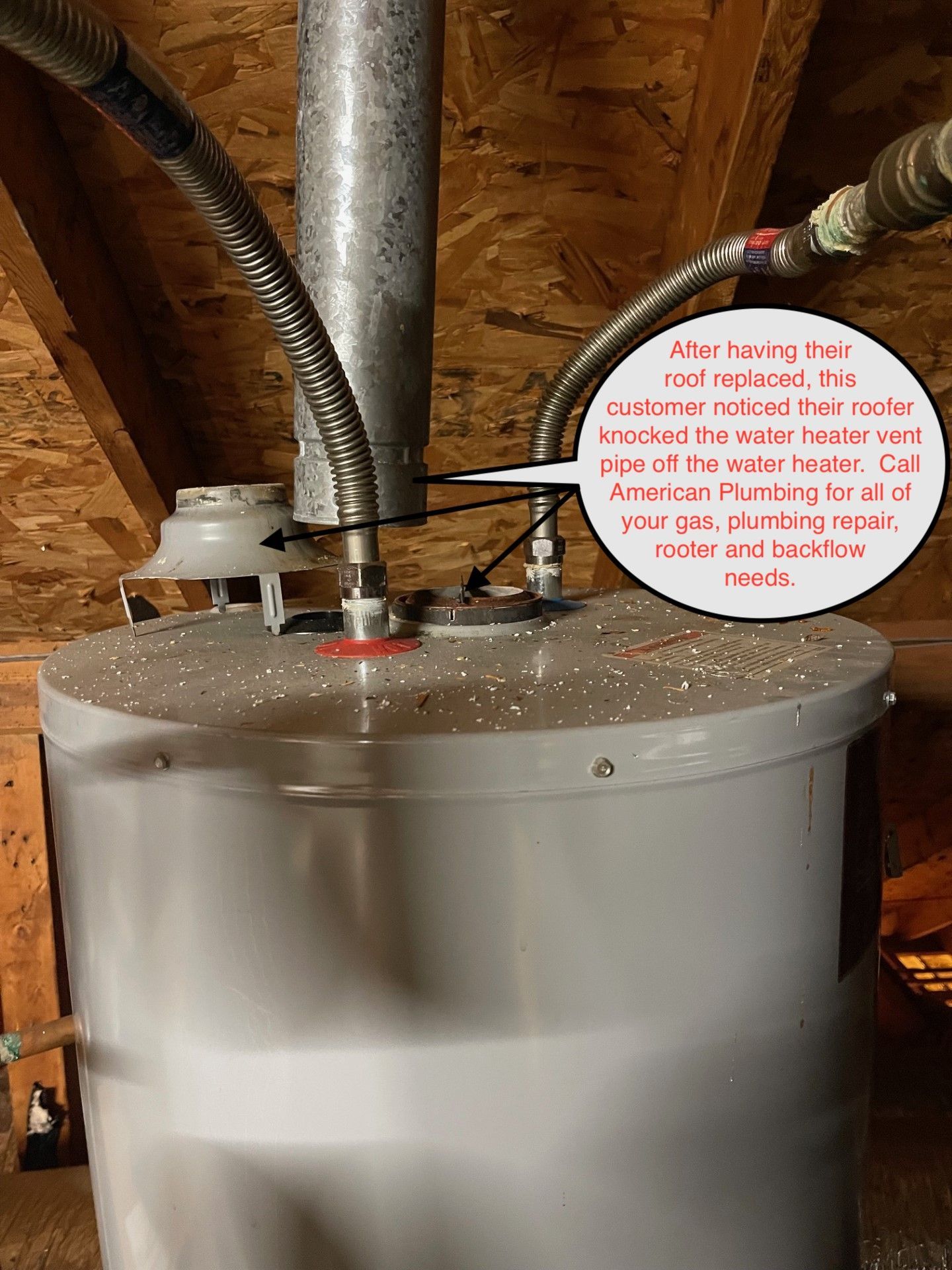 Water heater in a utility room with pipes and a red warning label on top.