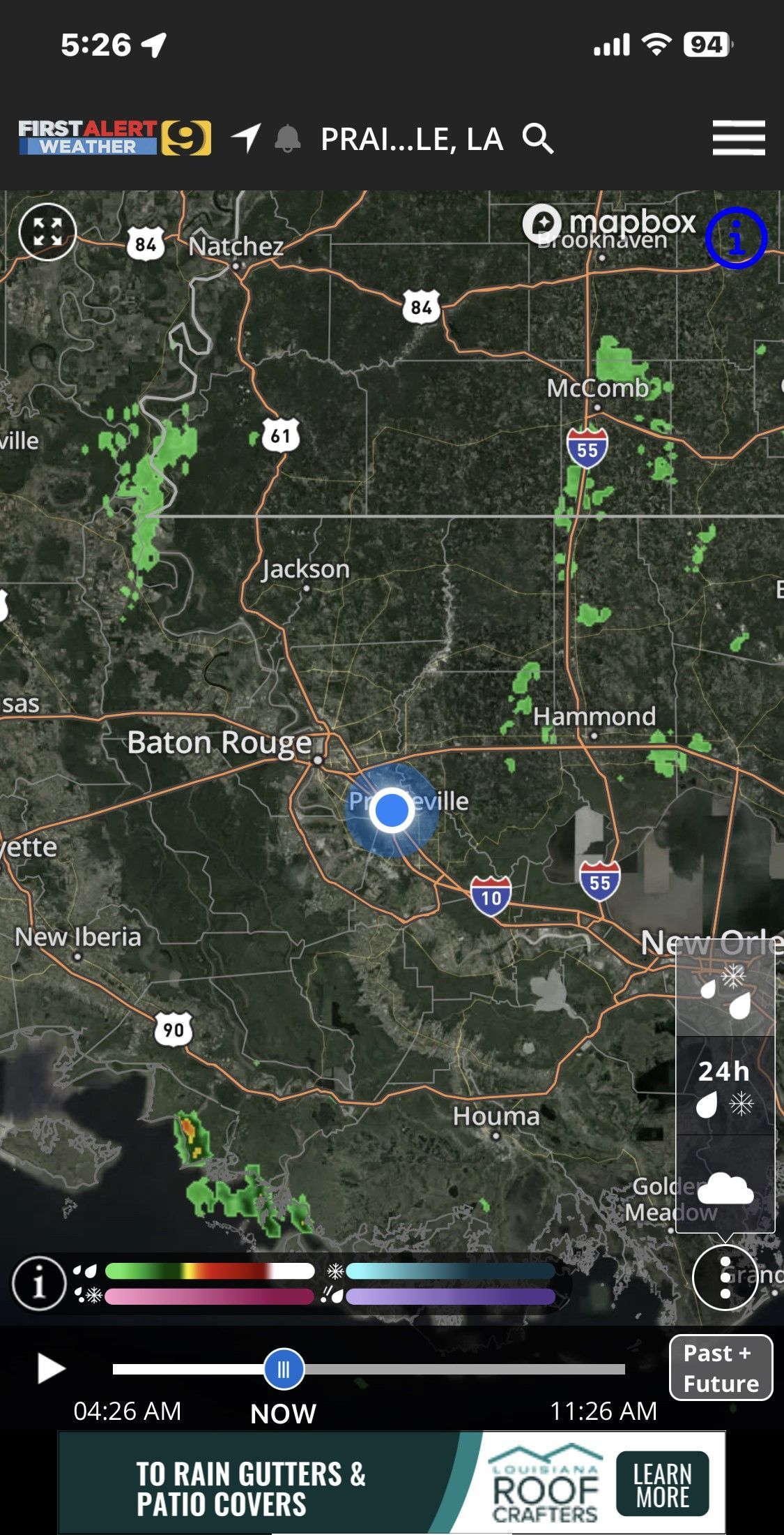 Satellite map with a blue location marker, route lines, and game-style icons on a phone screen.