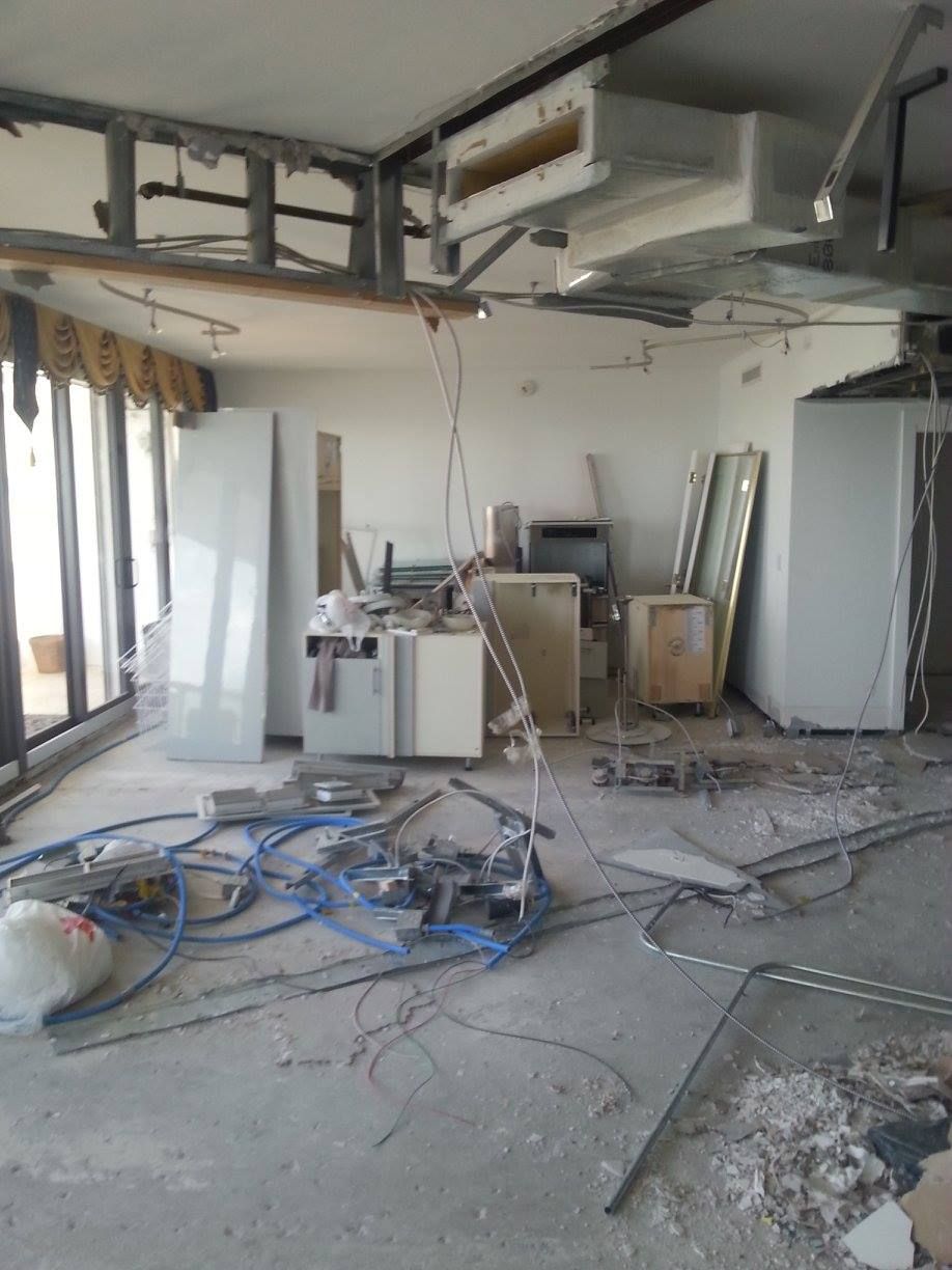 A room that is being remodeled with a lot of wires on the floor.