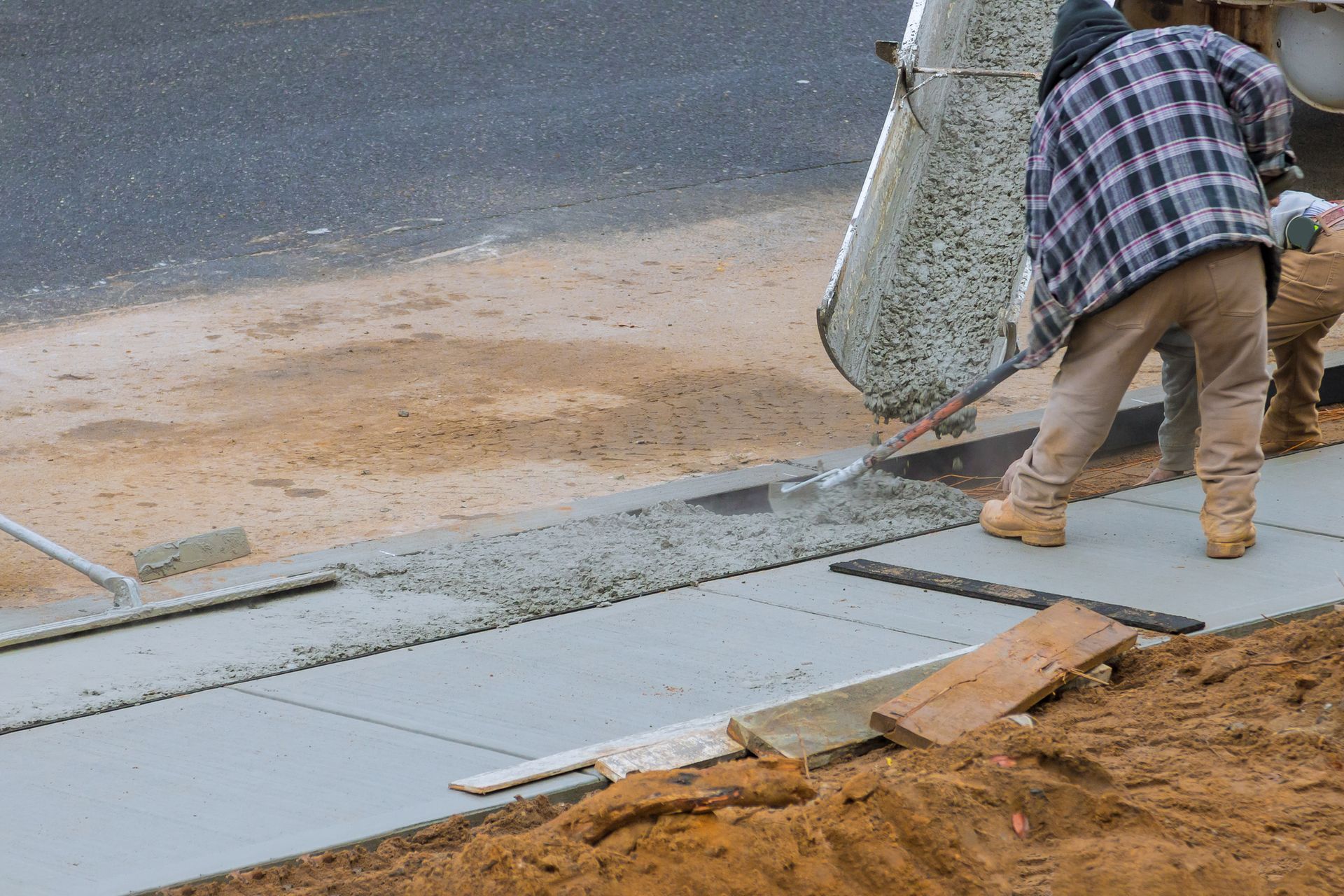 A Man Is Pouring Concrete Onto A Sidewalk - Columbus, IN - Orville K. Fleetwood Asphalt A Man Is Pouring Concrete Onto A Sidewalk - Columbus, IN - Orville K. Fleetwood Asphalt