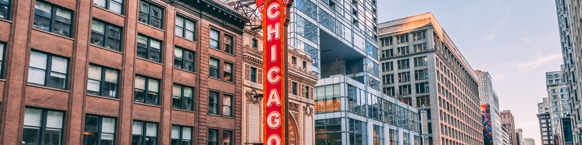 A city street with a red sign that says chicago on it.