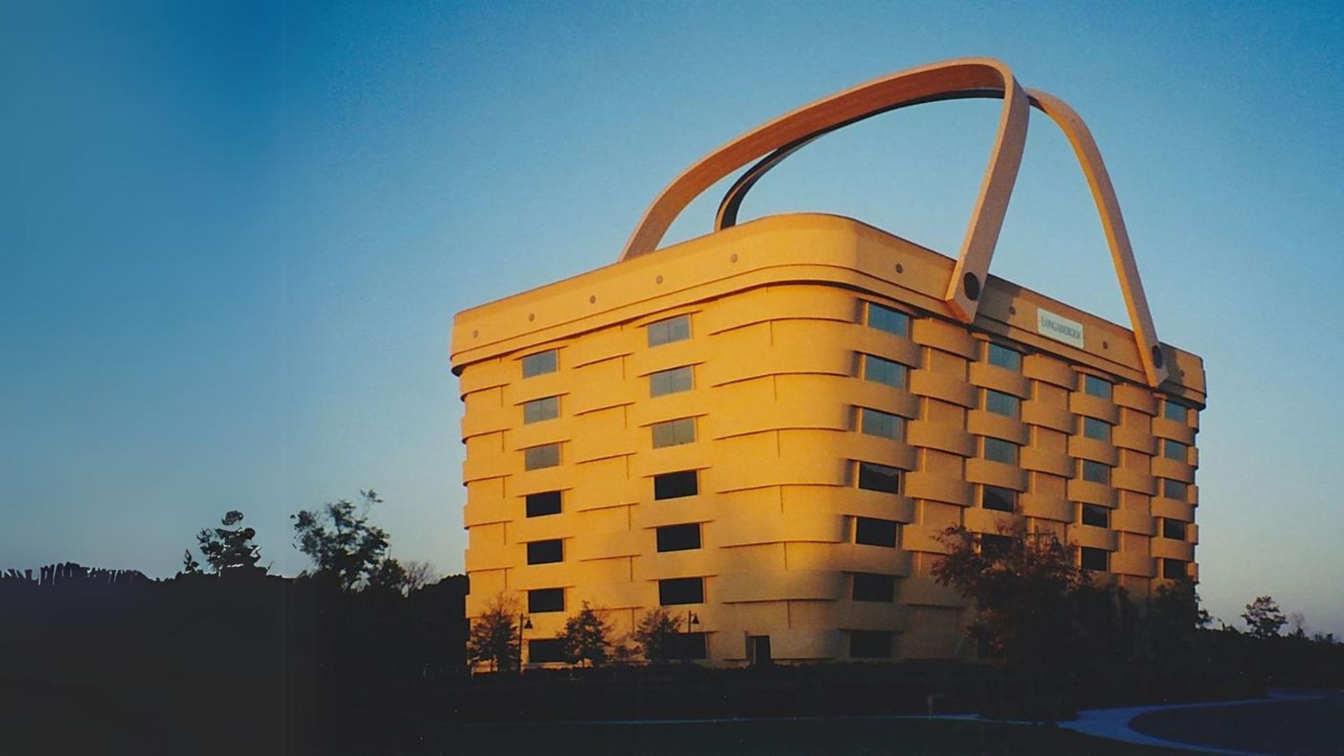 A building that looks like a basket with a large handle