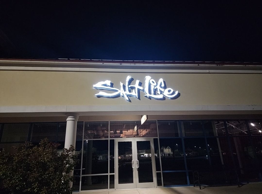 Salt life retail store in strip mall night
