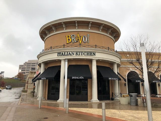 A large building with a sign that says bravo italian kitchen