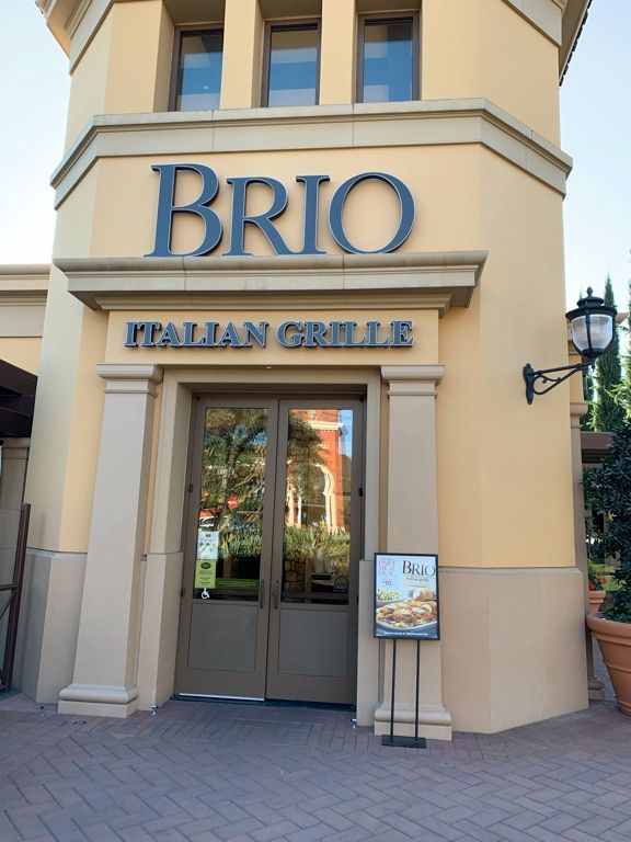 A building with a sign that says brio italian grille