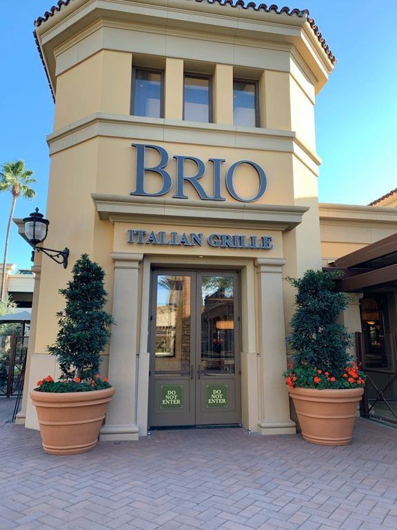 A building with a sign that says brio italian grills