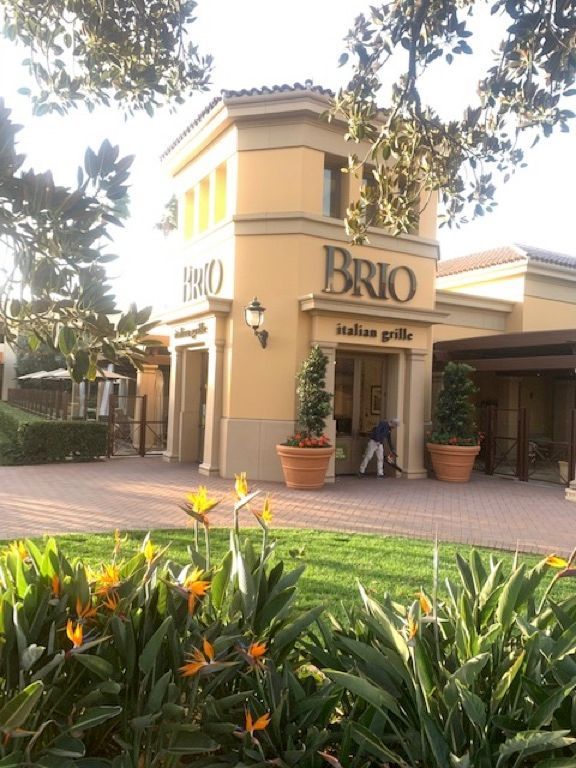 A yellow building with the word brio on it