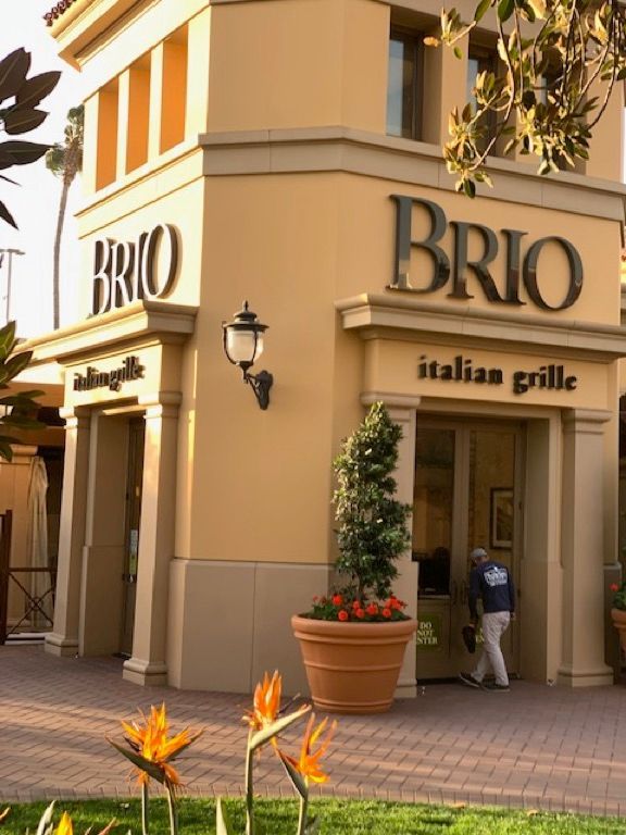 A yellow building with the word brio on it