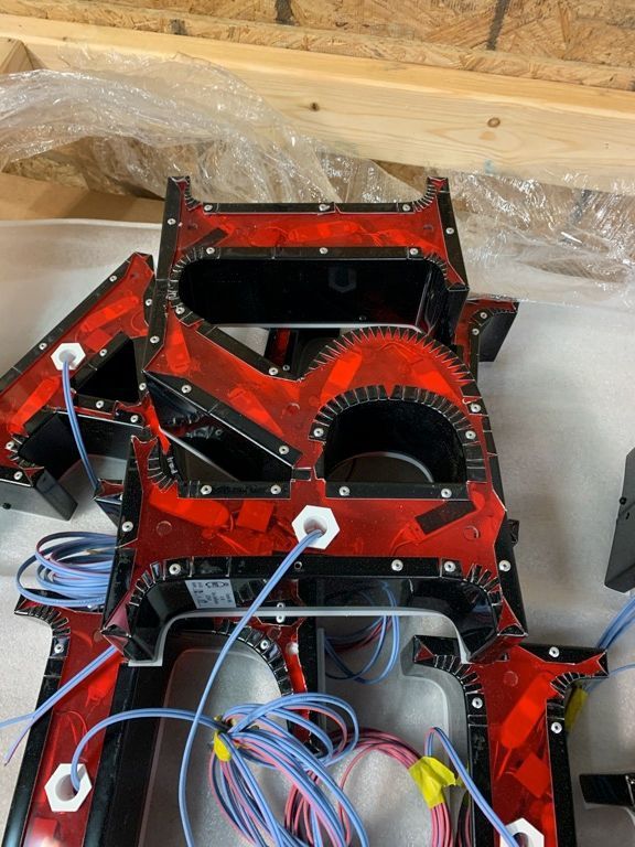 A red and black item with wires attached to it