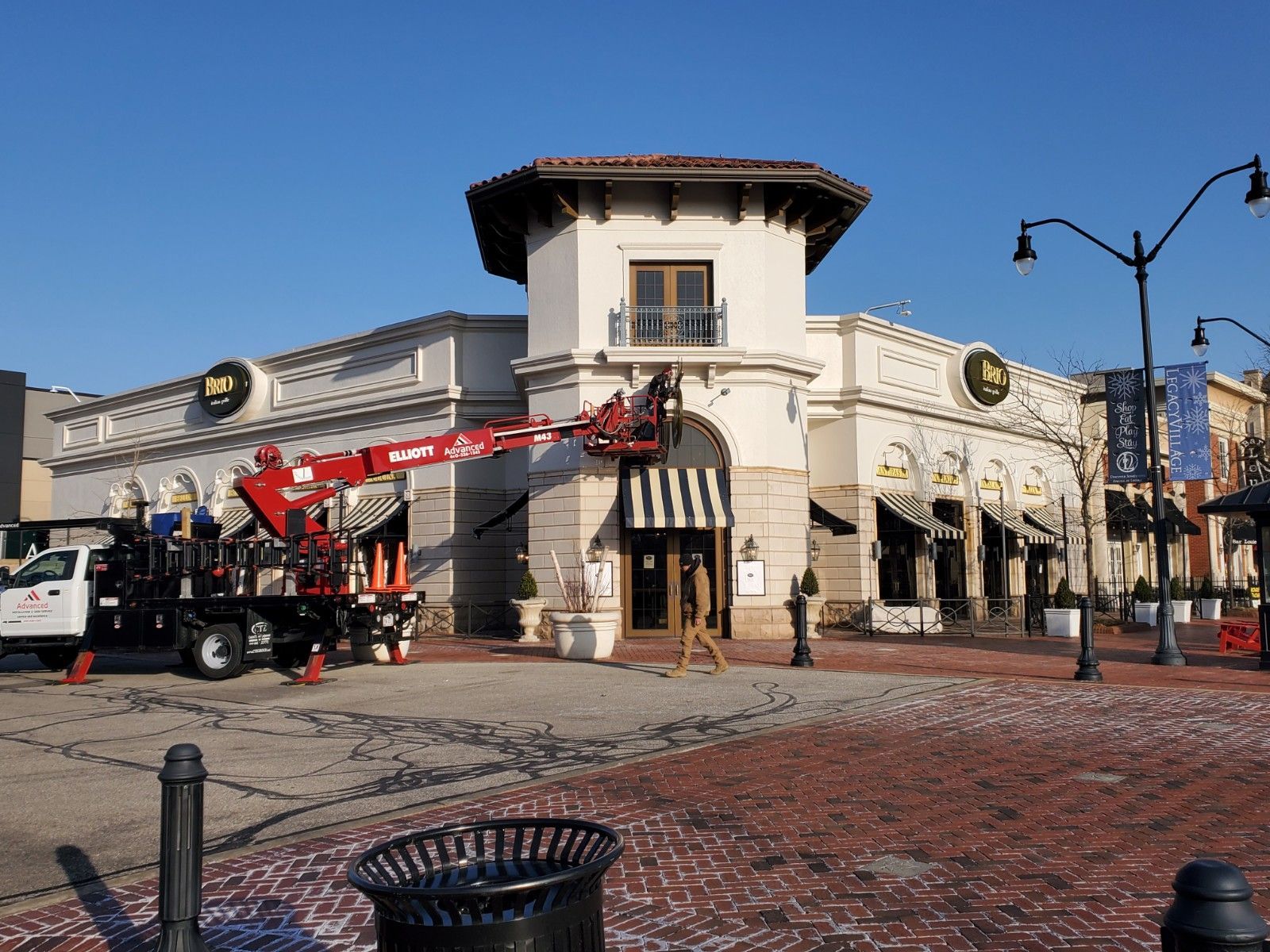 A large building with a crane in front of it